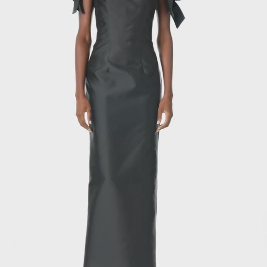 Monique Lhuillier Fall 2024 off the shoulder sheath dress with bow sleeves in Noir mikado - video.