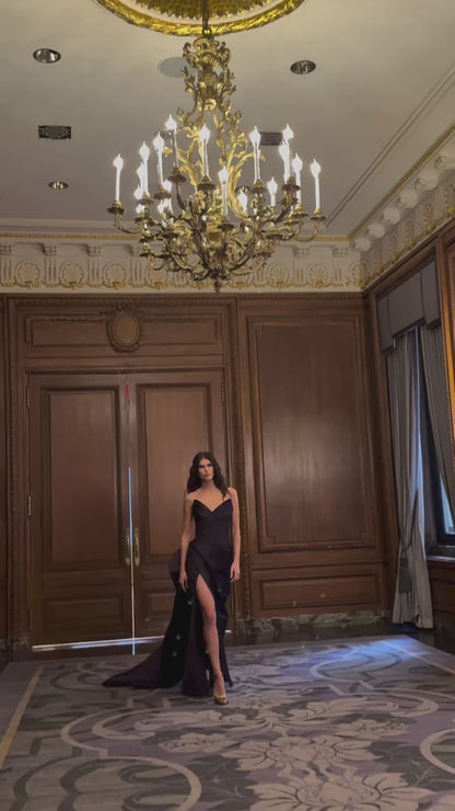 Monique Lhuillier Fall 2025 floor length gown with draped bodice and front leg slit in violet mikado fabric - Instagram Reel with model