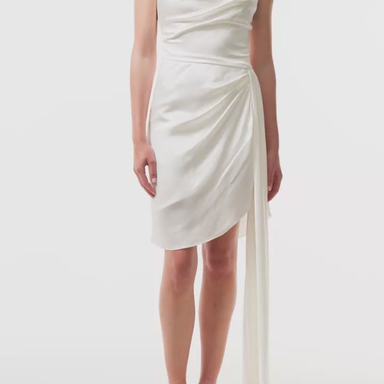 Silk white satin mini dress with asymmetric hem, side sweeping train and spaghetti straps - video.