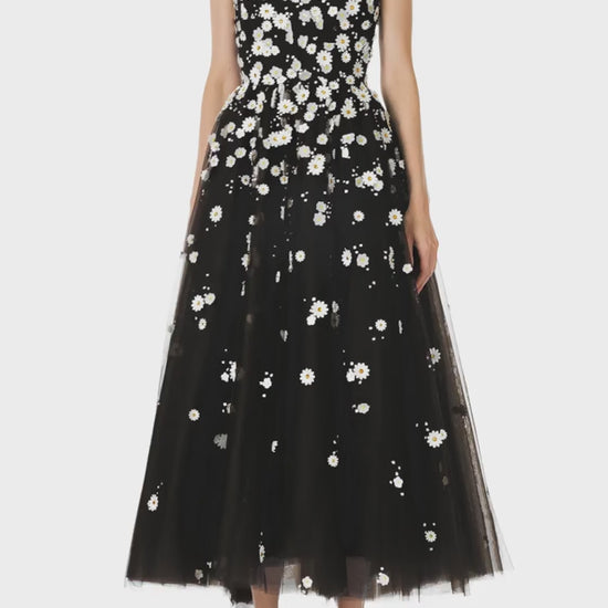 Monique Lhuillier Spring 2025 Noir tulle cape with Daisy embroidery and hook and eye closure at front of neckline - video.