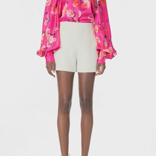 Monique Lhuillier Long sleeve blouse with high neck and buttons down center front in Fuchsia Floral printed satin -  video