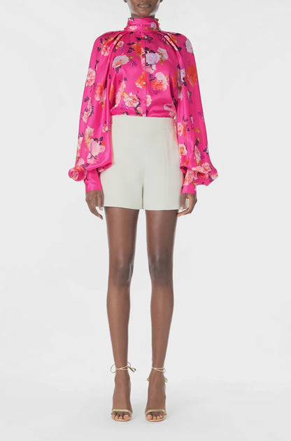 Monique Lhuillier Long sleeve blouse with high neck and buttons down center front in Fuchsia Floral printed satin -  video