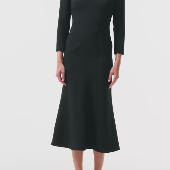 Monique Lhuillier Fall 2025 Noir Long sleeve midi dress in lightweight silk wool suiting - video.