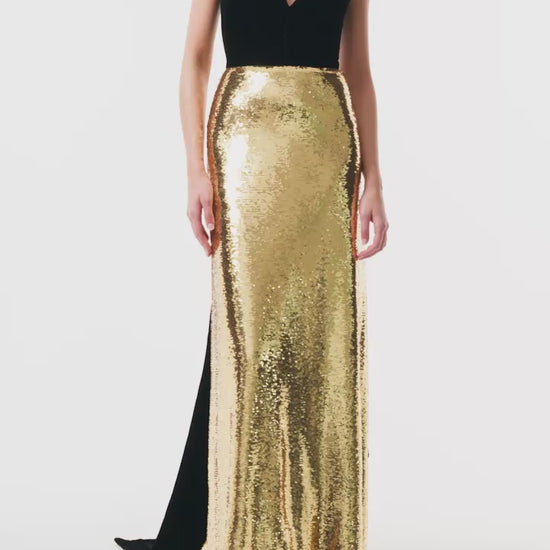 Monique Lhuillier Fall 2025 deep v-neck gown with train in noir velvet and gold sequins - video.