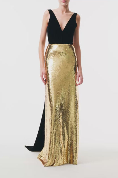 Monique Lhuillier Fall 2025 deep v-neck gown with train in noir velvet and gold sequins - video.