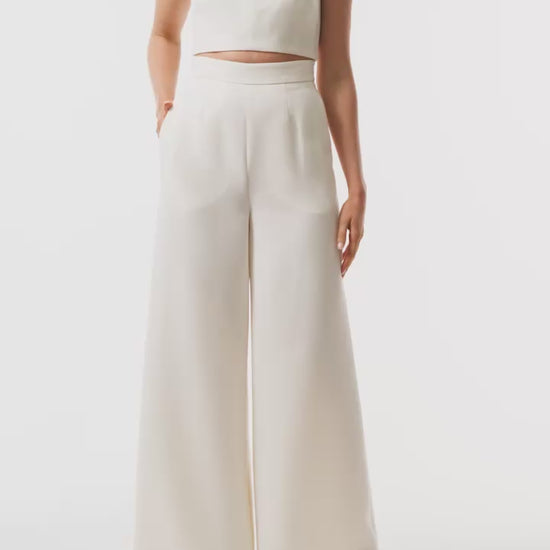 Monique Lhuillier Spring 2025 strapless bandeau in silk white wool suiting fabric - video.