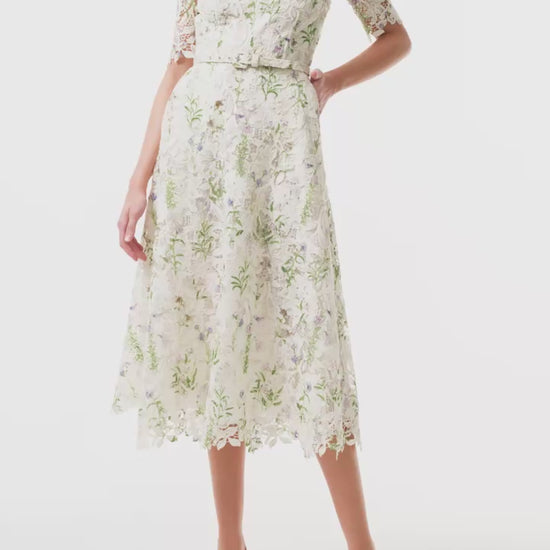 Monique Lhuillier Fall 2025 Floral Multi pressed floral printed lace short sleeve day dress with belt - video.