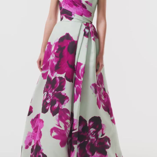 Monique Lhuillier Fall 2025 strapless ballgown with high leg slit and pockets in electric floral printed gazar - video.