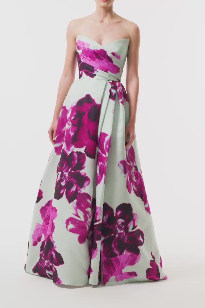 Monique Lhuillier Fall 2025 strapless ballgown with high leg slit and pockets in electric floral printed gazar - video.