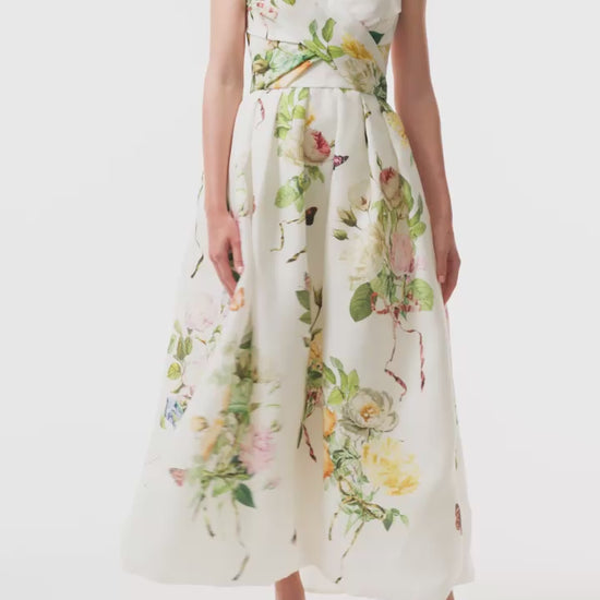 Strapless, tea-length dress in floral printed gazar with draped bodice and pockets - video.