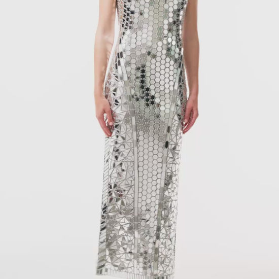 Monique Lhuillier Fall 2025 sleeveless, midi-length shift dress in silver mirrored embroidery - video.