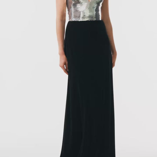 Monique Lhuillier Fall 2025 v-neck gown with silver sequin bodice and noir velvet skirt - video.