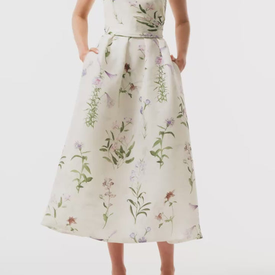 Monique Lhuillier Fall 2025 strapless dress with pleated waistline in floral printed gazar fabric - video.