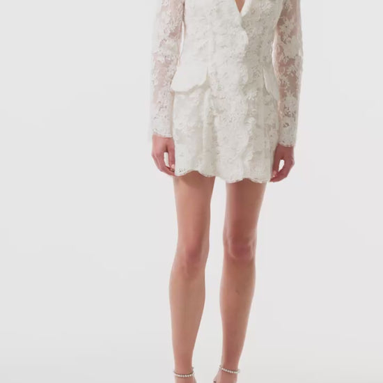 Monique Lhuillier "Claude" dress - long sleeve lace mini dress with v-neck and collar in silk white reembroidered lace - video.