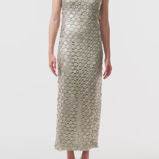 Monique Lhuillier Fall 2025 Sleeveless, tea-length shift dress in silver & gold disc embroidery - video.